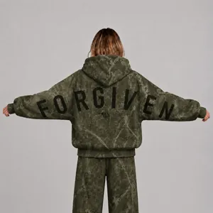 Detailed back view of oversized olive green camo hoodie with black FORGIVEN text