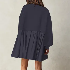 Detailed back view of a loose-fitting navy blue pleated sweatshirt dress for women.