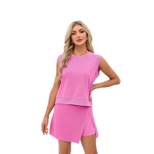 Women's chic pink two-piece set featuring a sleeveless round neck top and asymmetric skort.