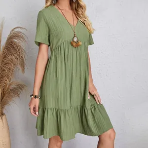 Elegant loose green short sleeve V-neck flowy dress featuring a premium textured fabric