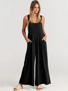Elegante mono casual de algodón y lino negro con pernera ancha y tirantes para mujer