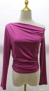 Elegant fuchsia asymmetrical off-shoulder long sleeve top with stylish ruched waist detail.