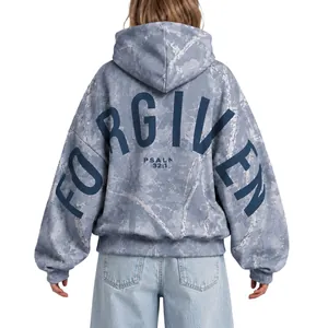 Women's oversized blue marble print hoodie featuring large 'FORGIVEN' text design on the back