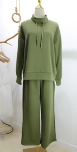Detailed view of casual long sleeve drawstring pullover and wide-leg pants set in olive green