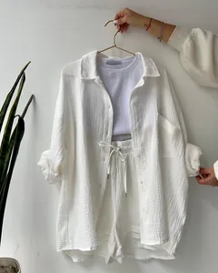 Casual white textured crepe two-piece set featuring long sleeve shirt and shorts