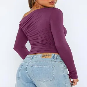 Purple asymmetric one-shoulder long sleeve top with ruched fabric texture detail view