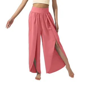 Detail view of coral high-waisted wide-leg yoga pants with elegant front splits