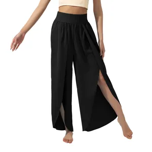Detail of black high waisted wide leg pants with high side slits for yoga and casual wear.