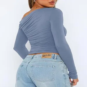 Stylish blue one-shoulder long sleeve cropped top featuring sexy ruched detailing for women