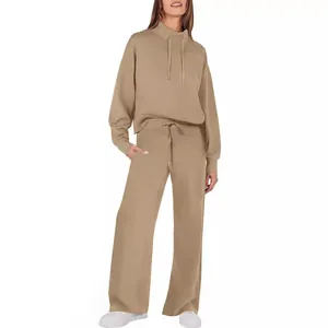 Two-piece loungewear set featuring long-sleeve hoodie and wide-leg drawstring pants.