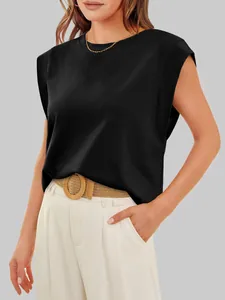 Close-up detail of a woman wearing a stylish black casual cap sleeve top with a round neck.