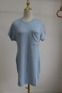 Detailed view of light blue short sleeve dress with wave texture and chest pocket