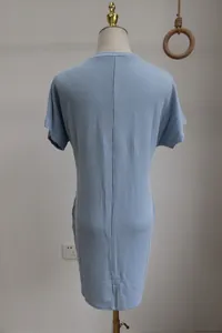 Detailed back view of a light blue wavy striped short sleeve summer dress on a mannequin
