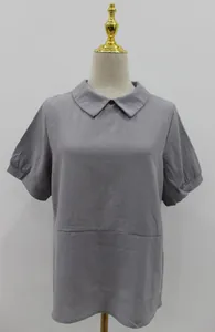 Detailed view of women's gray short sleeve cotton blouse with Peter Pan collar.