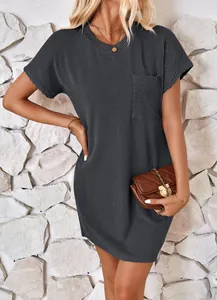 Detailed view of grey short-sleeve mini dress with ribbed texture and chest pocket.