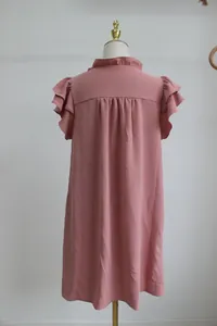 Back view of pink ruffle sleeve mini dress showing pleated detail and loose fit.