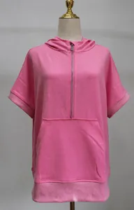 Close-up detail of casual pink short sleeve hooded sweatshirt with front metal zipper