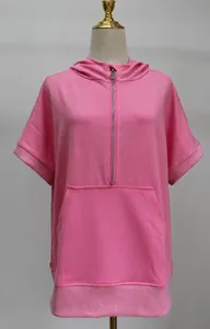 Close-up detail of casual pink short sleeve hooded sweatshirt with front metal zipper