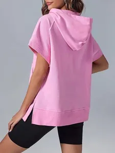 Back view of pink short sleeve hooded sweatshirt with side slits and hood detail.