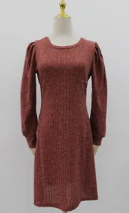 Detail view of red-brown knit dress with elegant puff long sleeves and round neck