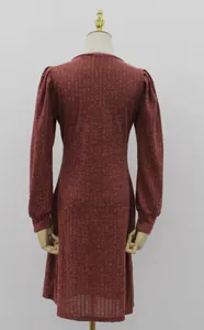Detailed back view of a burgundy ribbed knit dress with long puff sleeves on a mannequin.