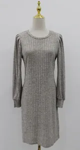 Full front view of a ribbed knit dress with bubble long sleeves on a mannequin.