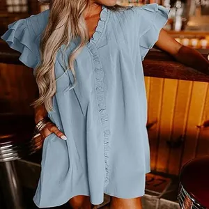 Detail of a light blue V-neck summer dress featuring delicate ruffled sleeves and front trim