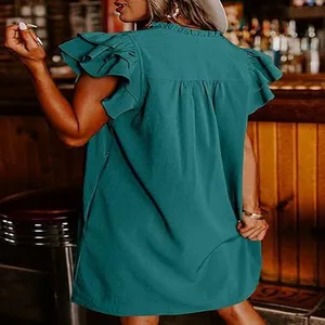 Detailed back view of a teal ruffle short sleeve mini dress in a loose straight fit
