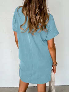 Back view of a summer light blue casual short sleeve ribbed mini dress for women
