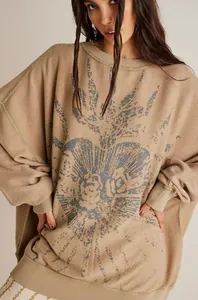 Detail view of American vintage oversized crewneck sweatshirt with heart print on model