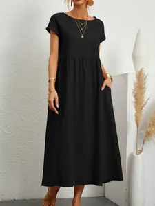 Elegante abito midi in cotone e lino nero con tasche laterali e vestibilità ampia