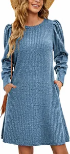 Close-up view of a light blue ribbed knit dress featuring puff sleeves and pockets.