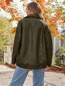 Detailed back view of women's oversized olive green faux leather biker jacket outdoors