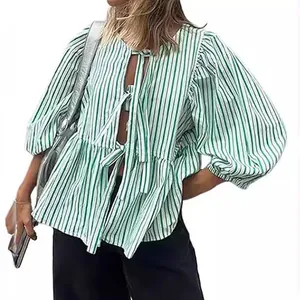 Green and white striped tie-front blouse with stylish puff sleeves and round neck.
