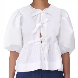 Elegant women's white puff sleeve blouse featuring stylish bow tie front and round neck design