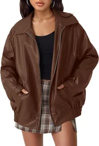 Close-up of oversized brown faux leather motorcycle jacket with elastic hem for women