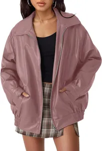 Front view detail of an oversized mauve faux leather moto jacket with a silver zipper.