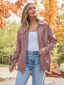 Detail view of a women's oversized mauve leather biker jacket in autumn setting