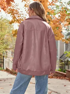 Back view of a stylish oversized mauve faux leather biker jacket in an autumn street setting.