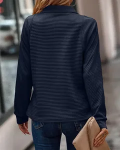Back view of a navy blue ribbed sweatshirt with a snake-bone texture and stand collar