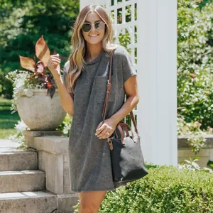 Casual women's summer short-sleeve ribbed dress with front pocket in a garden setting