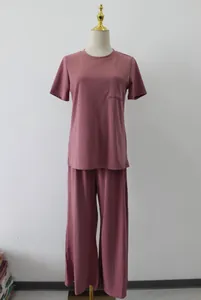 Two-piece mauve loungewear set featuring a pocket t-shirt and trendy wide-leg trousers