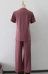 Back view of women's mauve 2-piece casual set featuring short-sleeve top and wide-leg pants