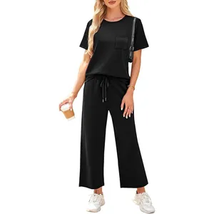Casual black two-piece summer set featuring short sleeve top and wide leg pants