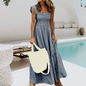 Detail of blue plaid maxi dress with ruffled straps and smocked bodice for summer