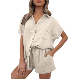 Detailed view of women's casual beige cotton linen button-down shirt and shorts two-piece set