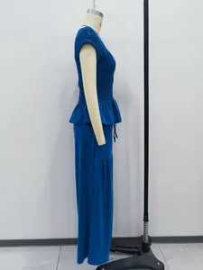 Detailed side view of a stylish blue peplum top and wide-leg trousers set on a mannequin.