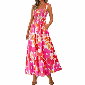 Vibrant floral smocked maxi dress with adjustable tie-straps and summer resort print.