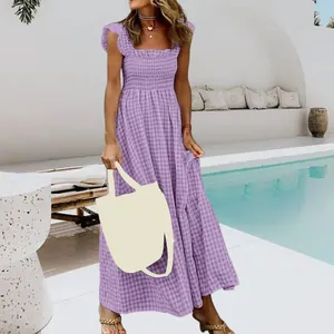 Elegant purple gingham maxi dress featuring smocked bodice and ruffle shoulder details