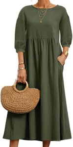 Detail view of dark green loose cotton linen dress with woven straw handbag